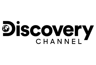A simple black and white line drawing of a person sitting at a desk, working on a laptop, with a cup next to the computer.